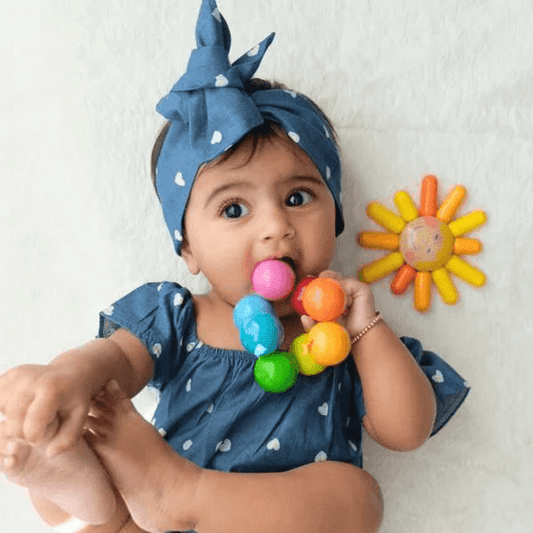 Baby Chewing on Teether