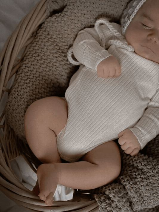 Baby Sleeping in Organic Cotton Clothing