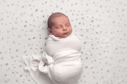 Newborn Baby Swaddled up in an organic swaddle