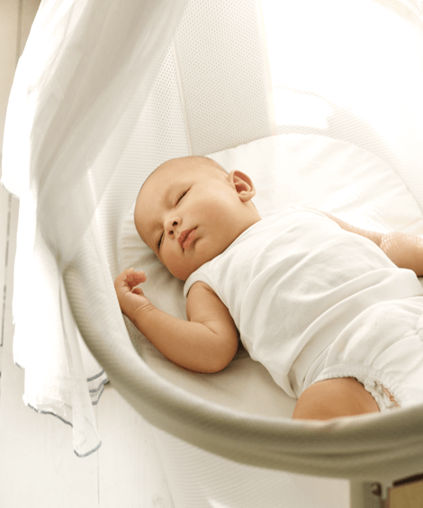 Sleeping Baby Surrounded in Organic Bedding