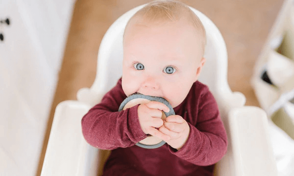 Baby chewing on teether