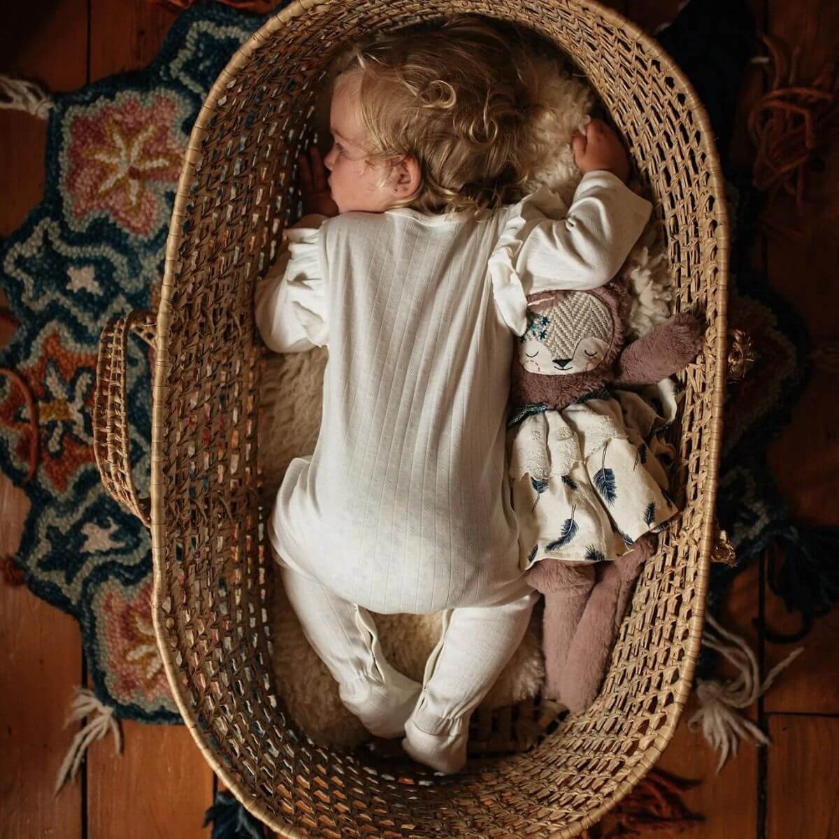 Baby sleeping in organic footie